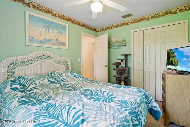 965 19th St SW, Vero Beach, FL 32962 - carpeted bedroom with a closet and a ceiling fan