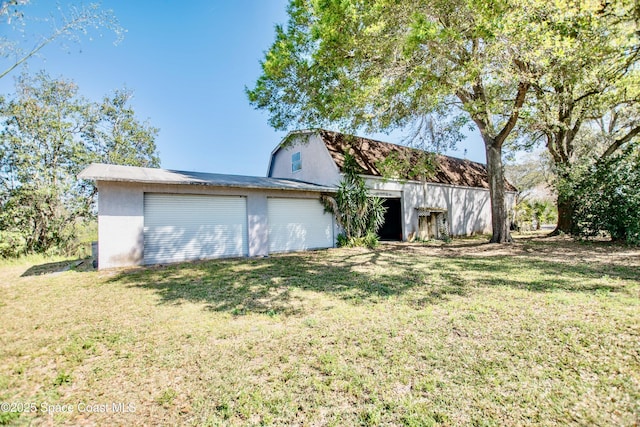 5510 Howell Branch Rd, Winter Park, FL 32792 - back of property with a lawn, a garage, stucco siding, and an outdoor structure