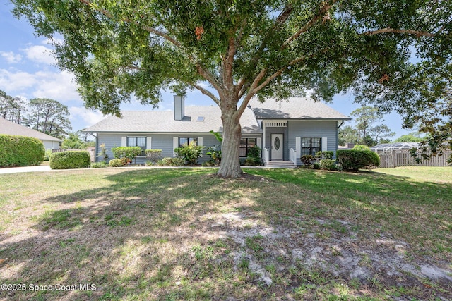 174 Peckham St NE, Palm Bay, FL 32907 - view of front of property with a chimney