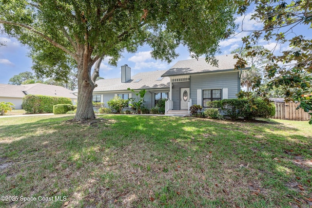 174 Peckham St NE, Palm Bay, FL 32907 - view of front of home with a chimney