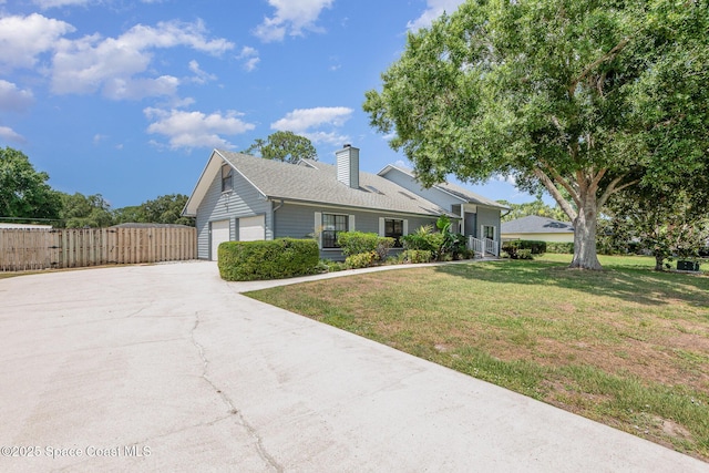 174 Peckham St NE, Palm Bay, FL 32907 - view of front of home featuring a chimney, driveway, a garage, and roof with shingles