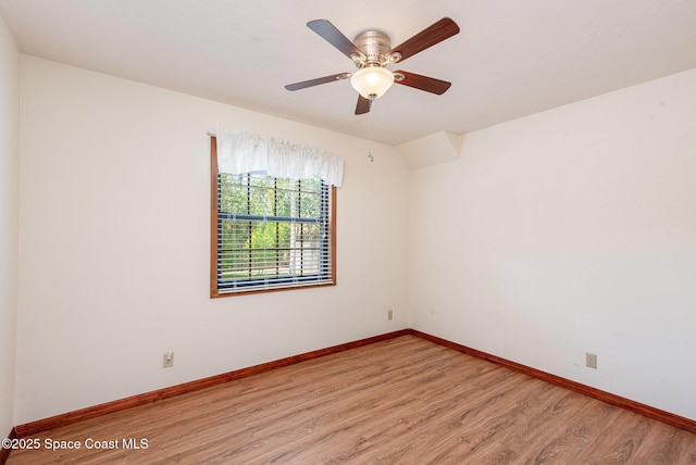 174 Peckham St NE, Palm Bay, FL 32907 - empty room featuring light wood-style flooring, baseboards, and a ceiling fan