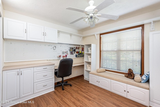 174 Peckham St NE, Palm Bay, FL 32907 - office featuring light wood-type flooring, built in study area, and a ceiling fan