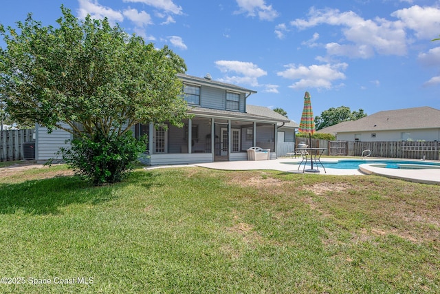 174 Peckham St NE, Palm Bay, FL 32907 - back of house with a sunroom, a patio, and central air condition unit