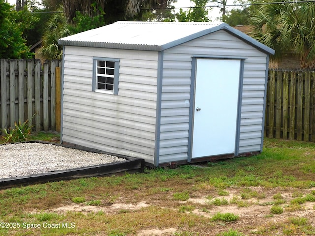 174 Peckham St NE, Palm Bay, FL 32907 - view of shed featuring a fenced backyard