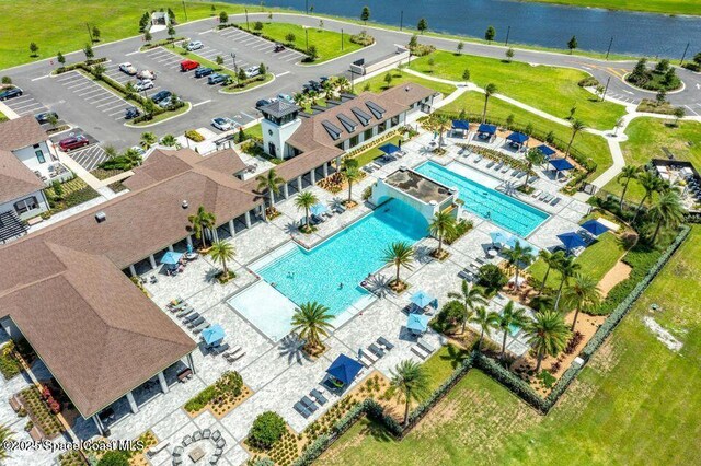 8854 Alister Dr, Melbourne, FL 32940 - drone / aerial view of a pool area and a nearby body of water