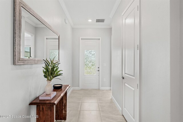 8854 Alister Dr, Melbourne, FL 32940 - entryway with crown molding, baseboards, and light tile patterned floors
