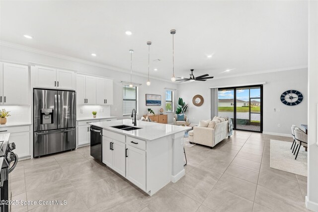 8854 Alister Dr, Melbourne, FL 32940 - kitchen featuring stainless steel refrigerator with ice dispenser, a sink, dishwashing machine, ornamental molding, and a ceiling fan
