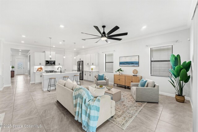 8854 Alister Dr, Melbourne, FL 32940 - living area featuring recessed lighting, light tile patterned flooring, a ceiling fan, baseboards, and crown molding
