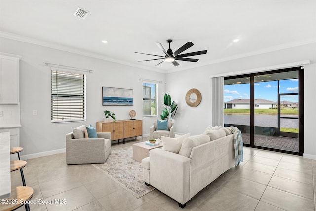 8854 Alister Dr, Melbourne, FL 32940 - living room with a ceiling fan, crown molding, light tile patterned floors, baseboards, and recessed lighting