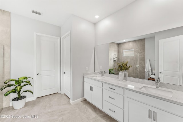 8854 Alister Dr, Melbourne, FL 32940 - bathroom with double vanity, a stall shower, baseboards, and recessed lighting