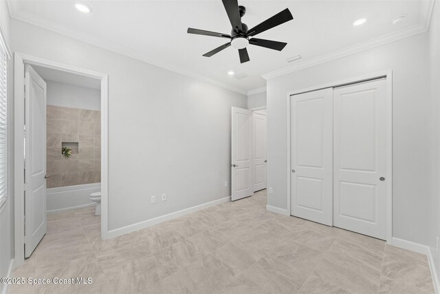 8854 Alister Dr, Melbourne, FL 32940 - unfurnished bedroom featuring a closet, ensuite bathroom, recessed lighting, baseboards, and crown molding