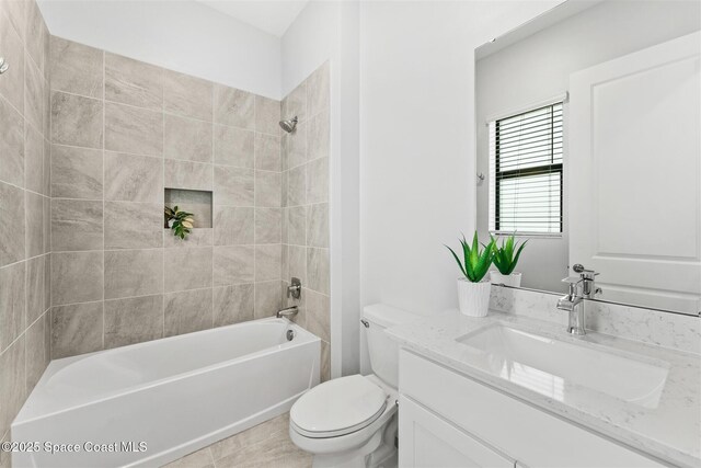 8854 Alister Dr, Melbourne, FL 32940 - full bathroom featuring vanity, toilet, and shower / bath combination