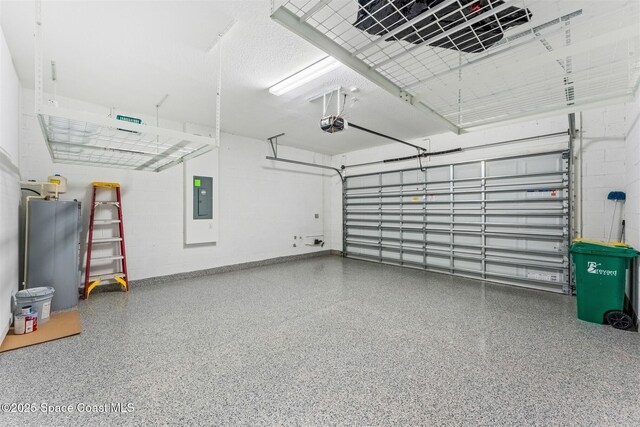 8854 Alister Dr, Melbourne, FL 32940 - garage with electric panel, a garage door opener, and concrete block wall