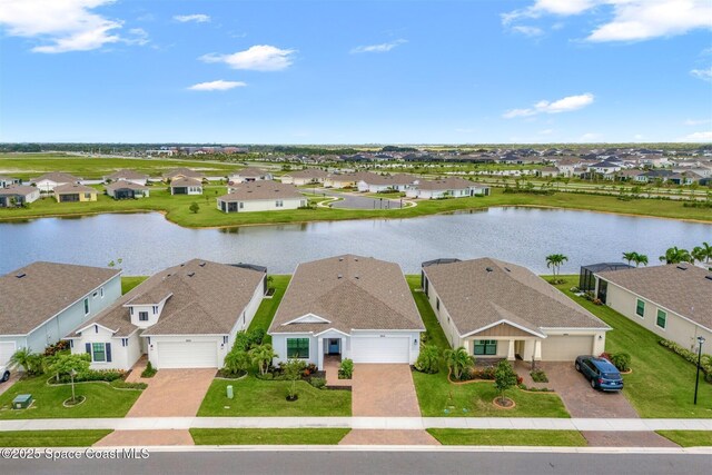 8854 Alister Dr, Melbourne, FL 32940 - aerial perspective of suburban area featuring a nearby body of water