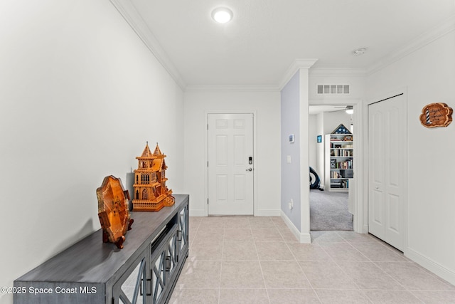 916 Corbin Cir SW, Palm Bay, FL 32908 - entrance foyer featuring crown molding, light tile patterned flooring, and baseboards