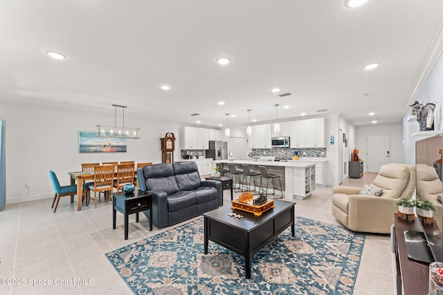 916 Corbin Cir SW, Palm Bay, FL 32908 - living area featuring light tile patterned floors, crown molding, recessed lighting, and baseboards