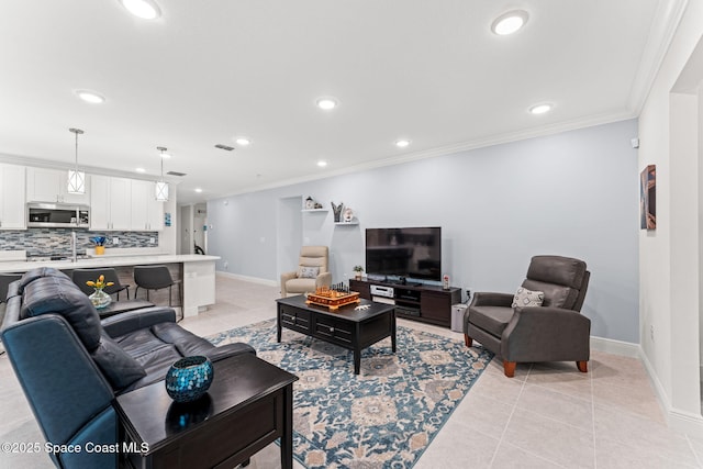 916 Corbin Cir SW, Palm Bay, FL 32908 - living area featuring baseboards, recessed lighting, crown molding, and light tile patterned floors