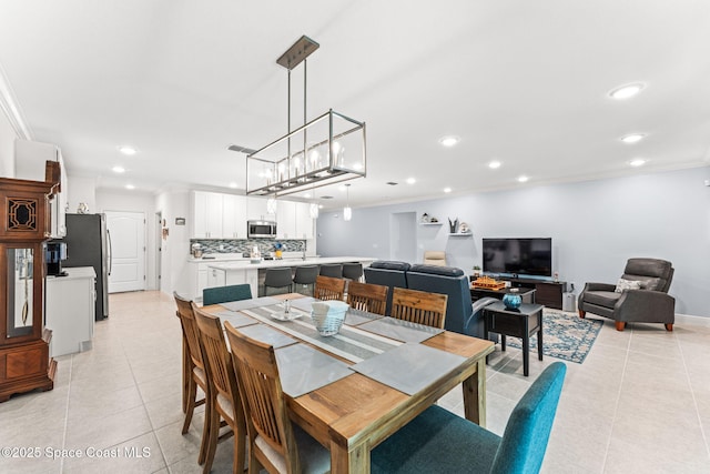 916 Corbin Cir SW, Palm Bay, FL 32908 - dining area featuring light tile patterned floors, ornamental molding, recessed lighting, and baseboards