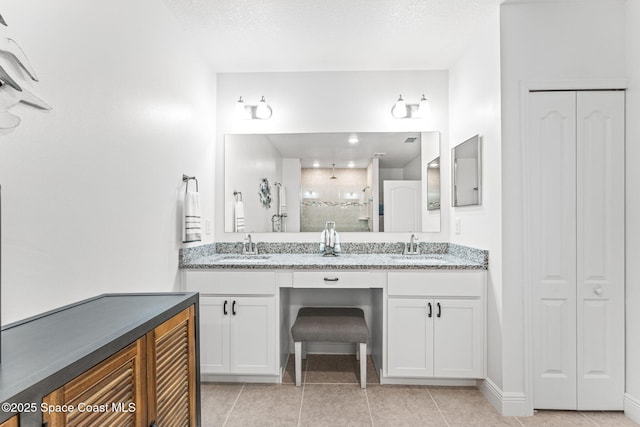 916 Corbin Cir SW, Palm Bay, FL 32908 - full bathroom featuring tile patterned floors, a tile shower, double vanity, and a closet