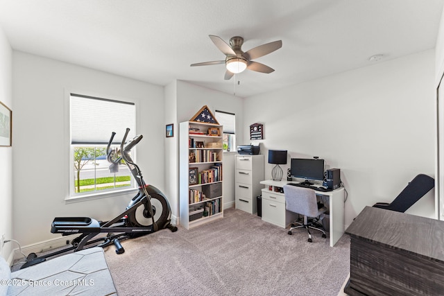 916 Corbin Cir SW, Palm Bay, FL 32908 - home office with plenty of natural light, a ceiling fan, baseboards, and light colored carpet