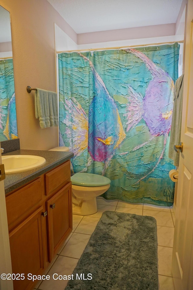 bathroom with vanity, a shower with curtain, and toilet