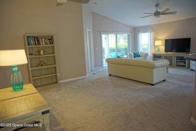 living room with a ceiling fan, carpet flooring, lofted ceiling, and baseboards