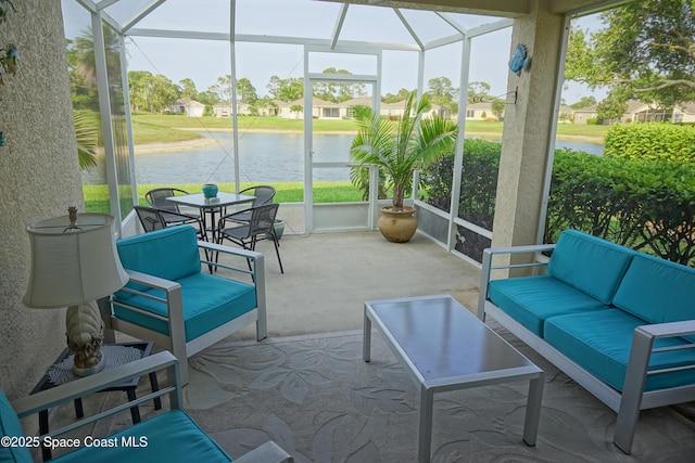 sunroom / solarium with outdoor lounge area and a water view