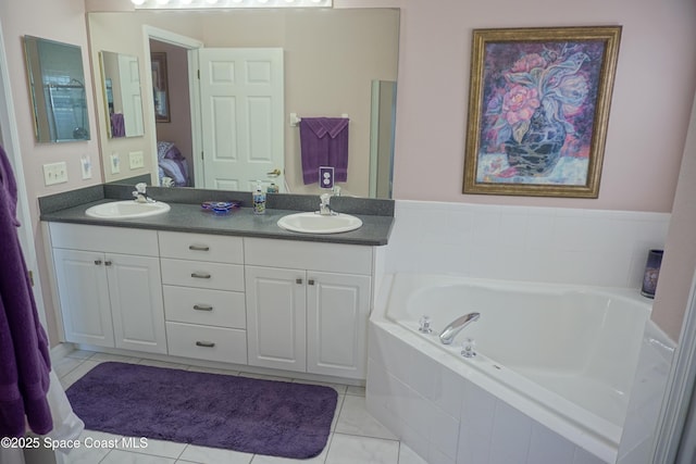 full bathroom with ensuite bath, double vanity, a garden tub, and tile patterned floors