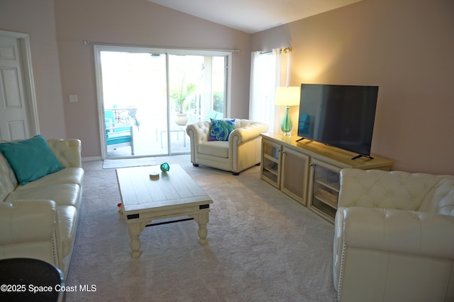 living room with lofted ceiling and light carpet
