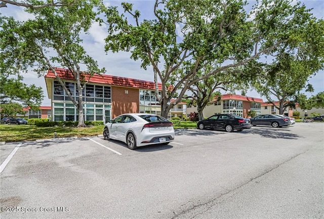 18 Vista Palm Ln Unit 102, Vero Beach, FL 32962 - view of uncovered parking lot