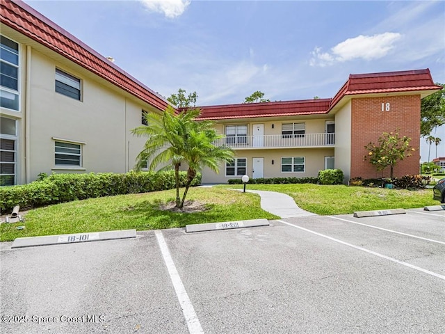 18 Vista Palm Ln Unit 102, Vero Beach, FL 32962 - view of building exterior featuring uncovered parking