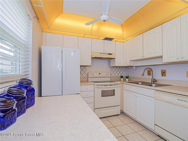 18 Vista Palm Ln Unit 102, Vero Beach, FL 32962 - kitchen featuring white appliances, under cabinet range hood, a ceiling fan, light countertops, and white cabinetry