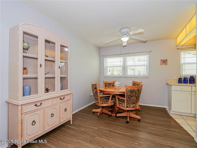 18 Vista Palm Ln Unit 102, Vero Beach, FL 32962 - dining room with ceiling fan, wood finished floors, and baseboards