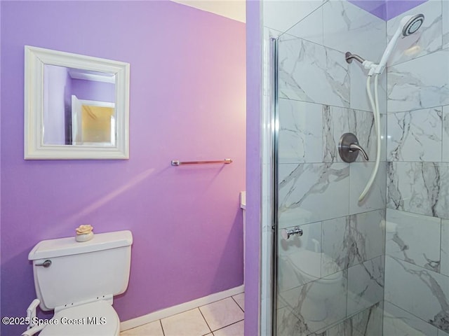 18 Vista Palm Ln Unit 102, Vero Beach, FL 32962 - full bathroom featuring a stall shower, toilet, tile patterned flooring, and baseboards