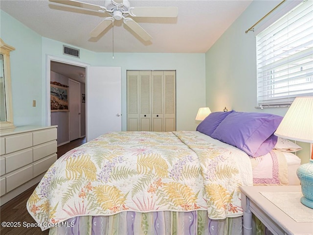 18 Vista Palm Ln Unit 102, Vero Beach, FL 32962 - bedroom with wood finished floors, a closet, and a ceiling fan
