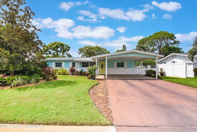 1029 Palmer Rd, Rockledge, FL 32955 - view of front of house featuring driveway and an attached carport