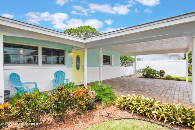 1029 Palmer Rd, Rockledge, FL 32955 - view of exterior entry with an attached carport