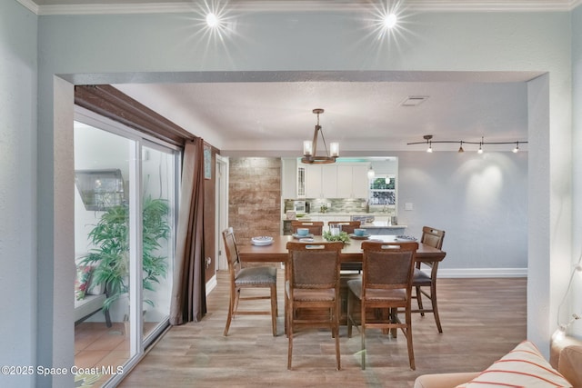 1029 Palmer Rd, Rockledge, FL 32955 - dining area with light wood-style floors