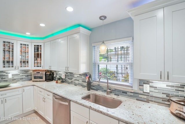 1029 Palmer Rd, Rockledge, FL 32955 - kitchen featuring dishwasher, backsplash, white cabinets, pendant lighting, and glass insert cabinets