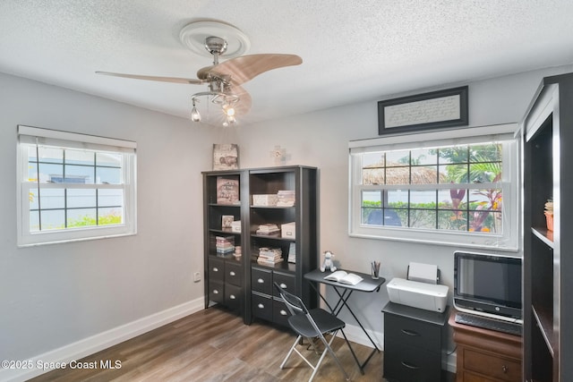 1029 Palmer Rd, Rockledge, FL 32955 - office area with a textured ceiling, plenty of natural light, wood finished floors, and ceiling fan