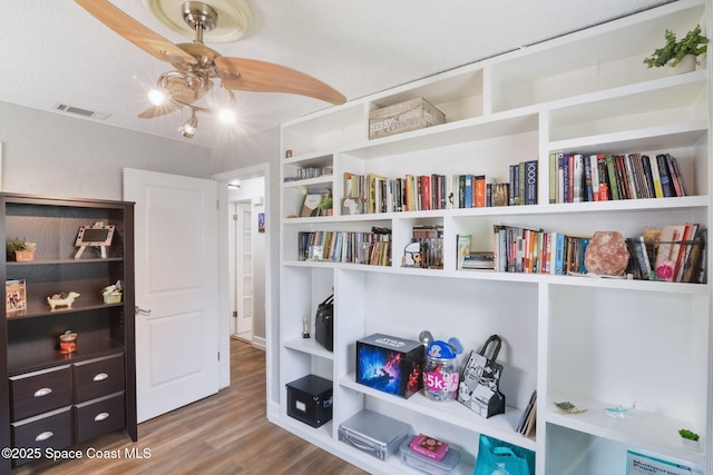 1029 Palmer Rd, Rockledge, FL 32955 - sitting room with ceiling fan and wood finished floors
