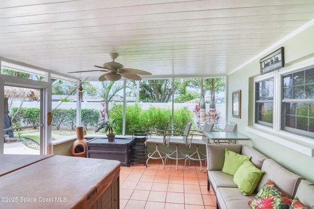 1029 Palmer Rd, Rockledge, FL 32955 - sunroom with outdoor lounge area, tile patterned floors, ceiling fan, and plenty of natural light
