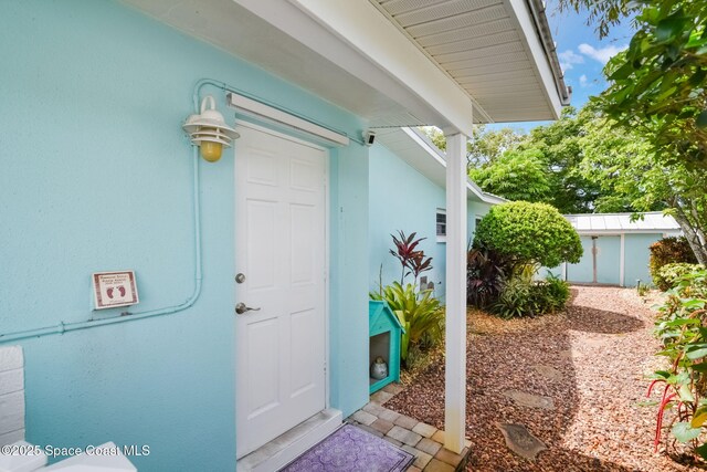1029 Palmer Rd, Rockledge, FL 32955 - view of exterior entry featuring stucco siding