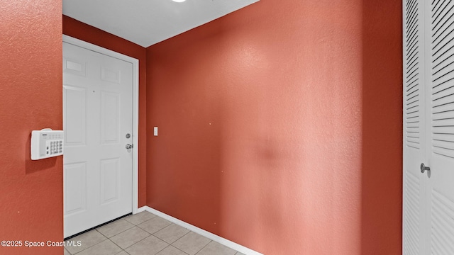 1766 Sophias Dr Unit 204, Melbourne, FL 32940 - entrance foyer featuring light tile patterned flooring and baseboards
