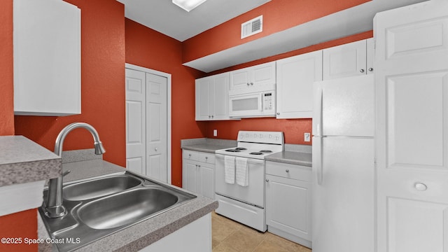1766 Sophias Dr Unit 204, Melbourne, FL 32940 - kitchen featuring white appliances, a sink, white cabinets, and light countertops