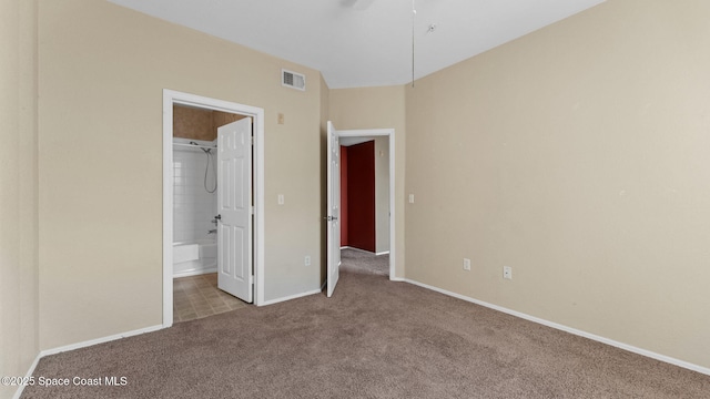 1766 Sophias Dr Unit 204, Melbourne, FL 32940 - unfurnished bedroom featuring carpet, baseboards, and ensuite bath