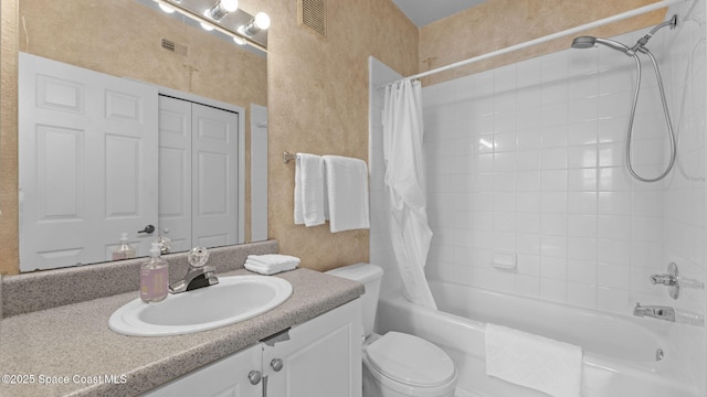 1766 Sophias Dr Unit 204, Melbourne, FL 32940 - full bath featuring shower / tub combo with curtain, vanity, a textured wall, and toilet