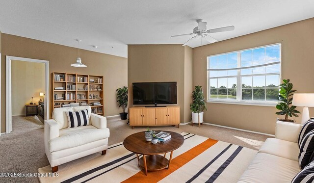 1766 Sophias Dr Unit 204, Melbourne, FL 32940 - living room with light colored carpet and a ceiling fan