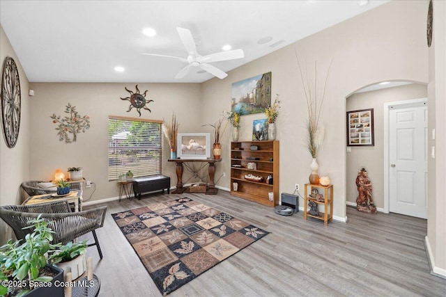 1160 Waco Blvd SE, Palm Bay, FL 32909 - living area featuring arched walkways, wood finished floors, recessed lighting, baseboards, and a ceiling fan
